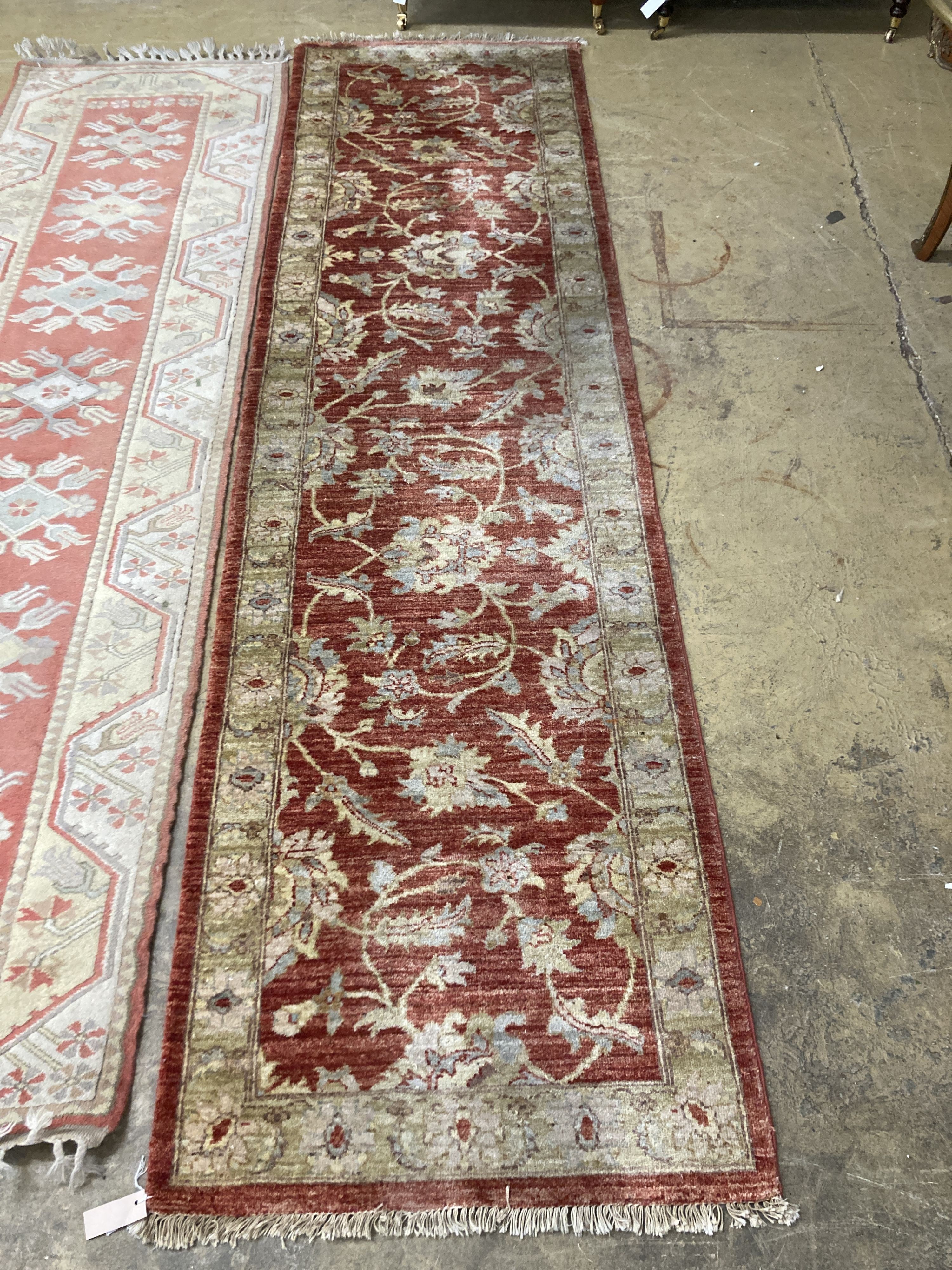 An Afghan Ziegler peach ground runner and another runner, largest 310 x 84cm